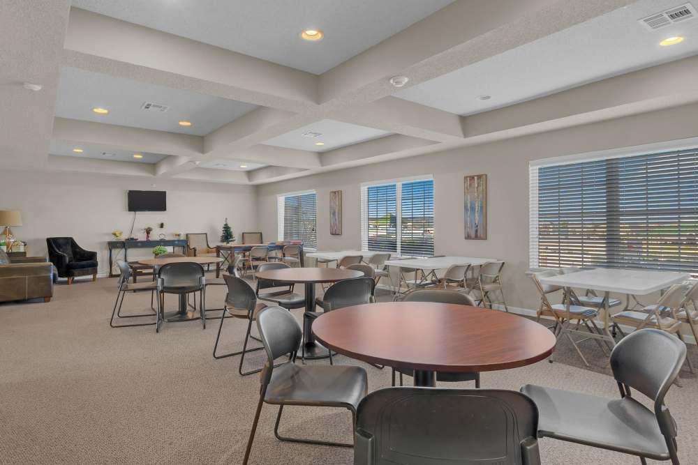 Community dining room with television at Hartford Villas in Broken Arrow, Oklahoma