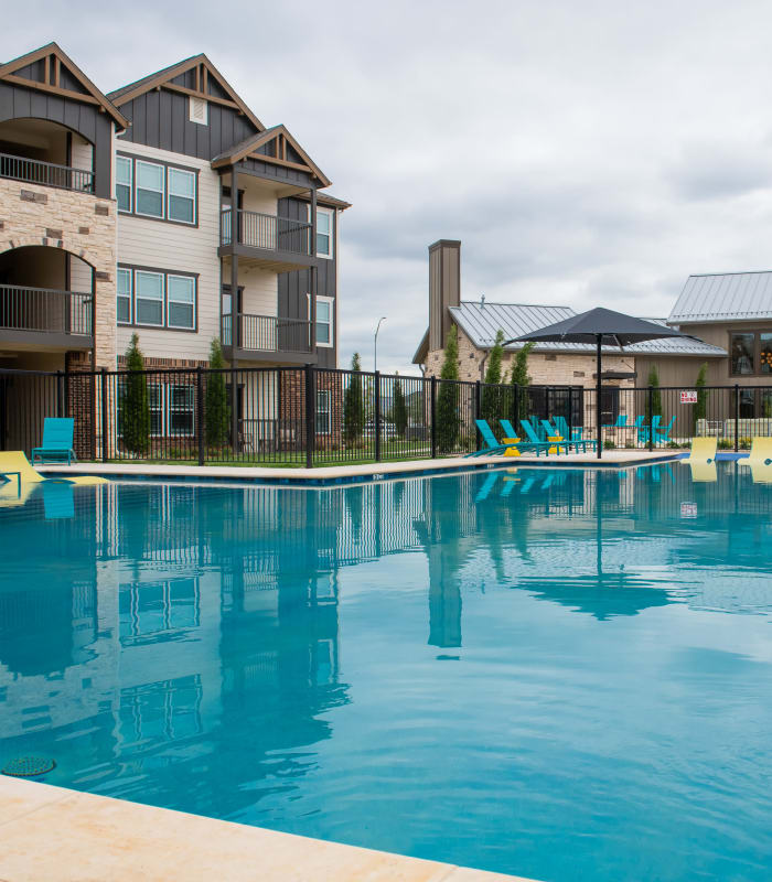 Large swimming pool at Bend at New Road Apartments in Waco, Texas