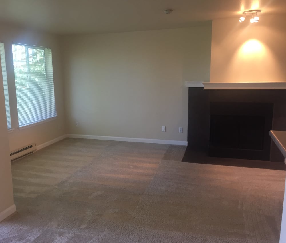 Large living room with a fire place at The Knoll Redmond in Redmond, Washington