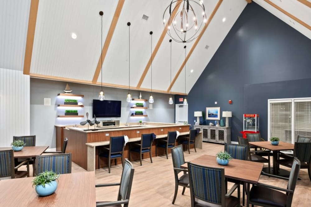 Chairs and tables with high ceiling room at Anthology of Simsbury in Simsbury, Connecticut