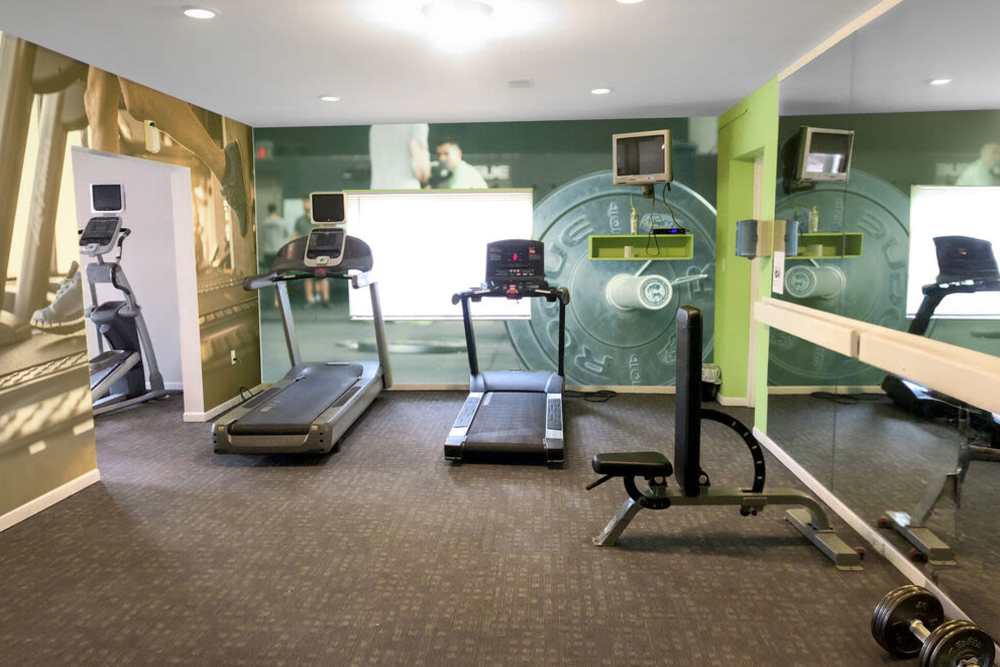 Fitness center with cardio equipment at Carriage Court in Cincinnati, Ohio
