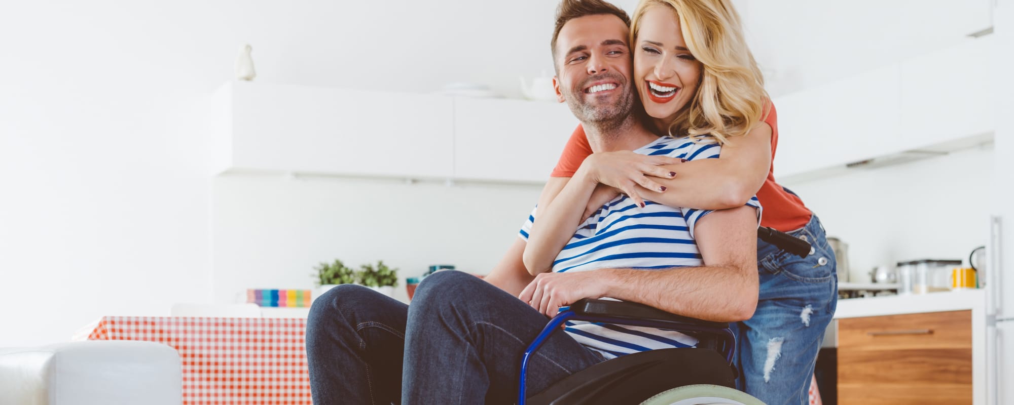 a resident couple in an embrace at Sunflower Terrace in Twentynine Palms, California