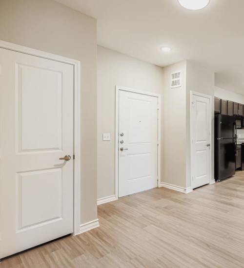 Open concept kitchen with modern appliances and stylish cabinetry at Standard at Royal Lane in Dallas, Texas