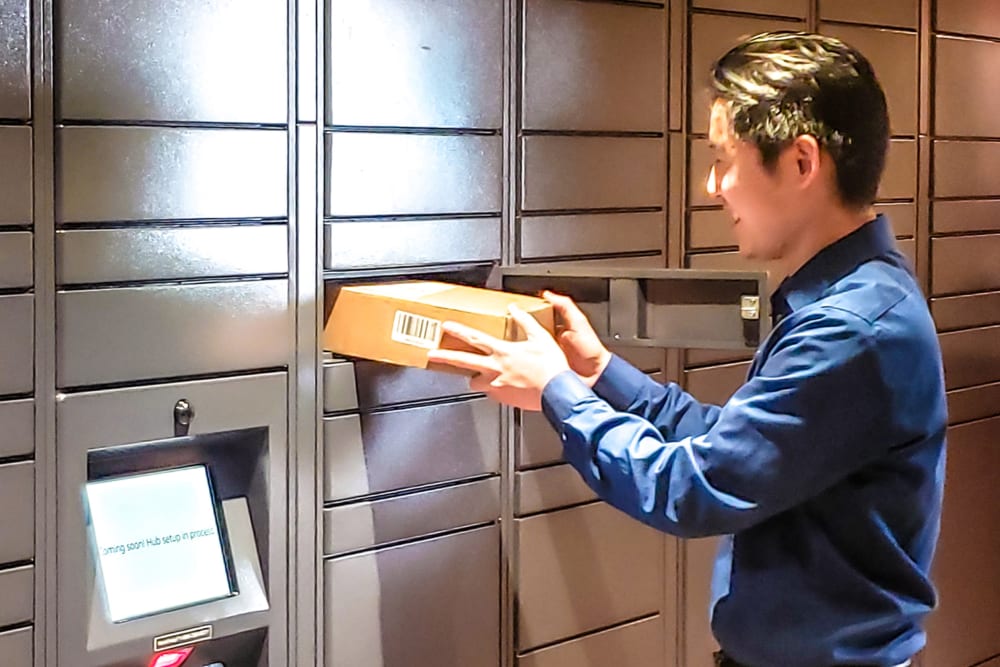 Resident picking up a package at Spring Creek Apartments in Santa Clara, California