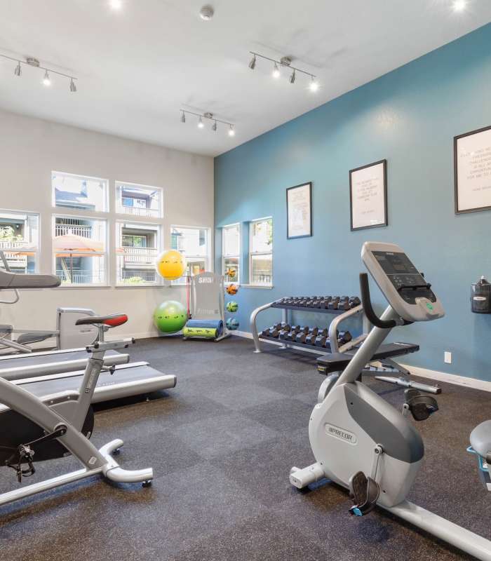 Gym with bike and free weights at Foundry on Fifth in Renton, Washington