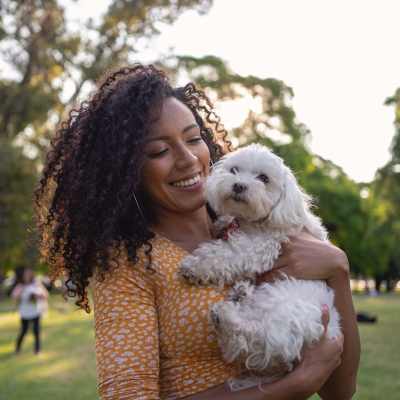 Resident with her dog in the park near Mill Creek Apartments in Cross Plains, Wisconsin