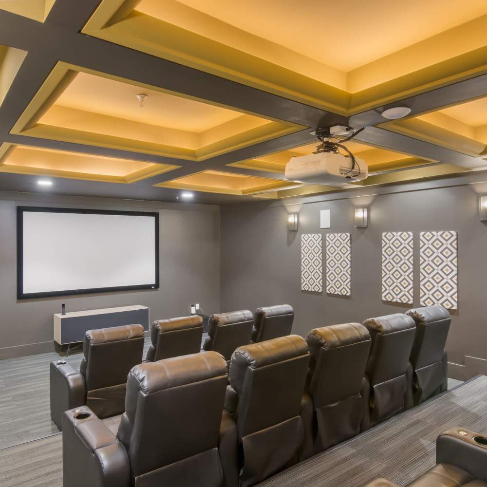 Cozy movie theater with plush seating at The Apartments At Kelton Station in Williamsburg, Virginia