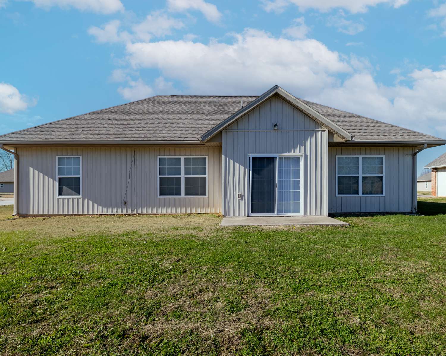 Charming residence with a spacious backyard and modern design at Prairie Hill Estates II in Carl Junction, Missouri.
