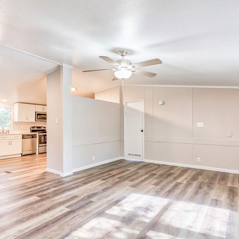 Bright living room with connecting kitchen at Canton Lakeside Village in Canton, Texas