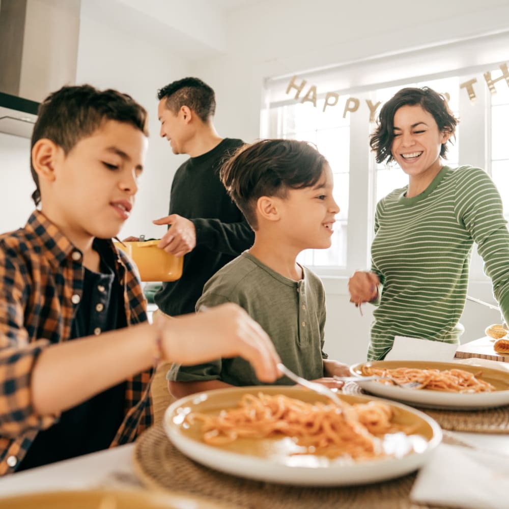 A family prepares a meal at Beacon on 5th in Charlottesville, Virginia