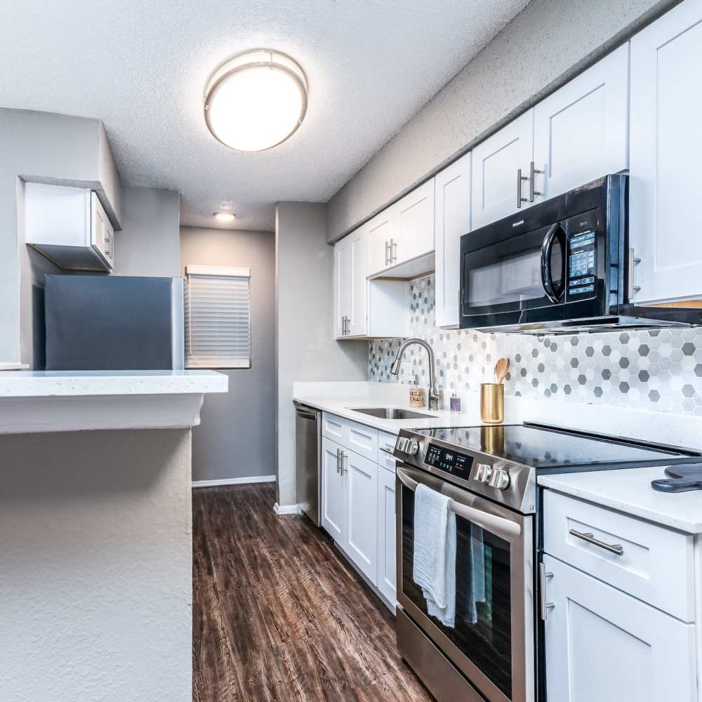 Garden style kitchen with stainless steel appliances at Sagamore Apartments in Benbrook, Texas
