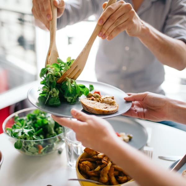 Residents enjoy a meal at their favorite spot near Attain at Quarterpath, Williamsburg, Virginia