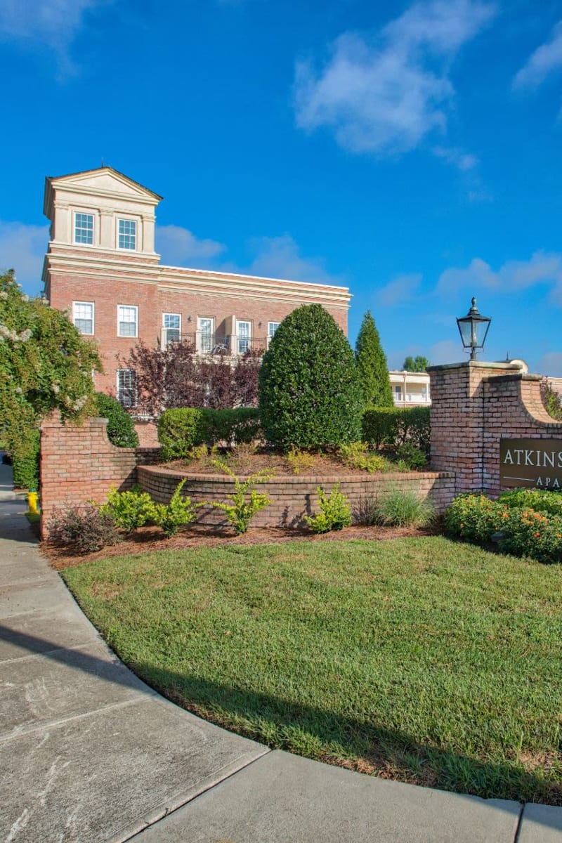 Exterior of Atkins Circle Apartments & Townhomes on a sunny spring day in Charlotte, North Carolina