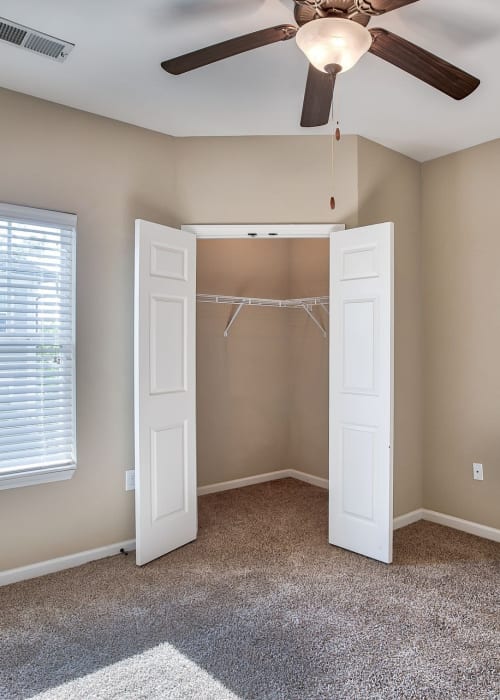 Bedroom with plush carpeting at Renaissance at Peacher's Mill in Clarksville, Tennessee