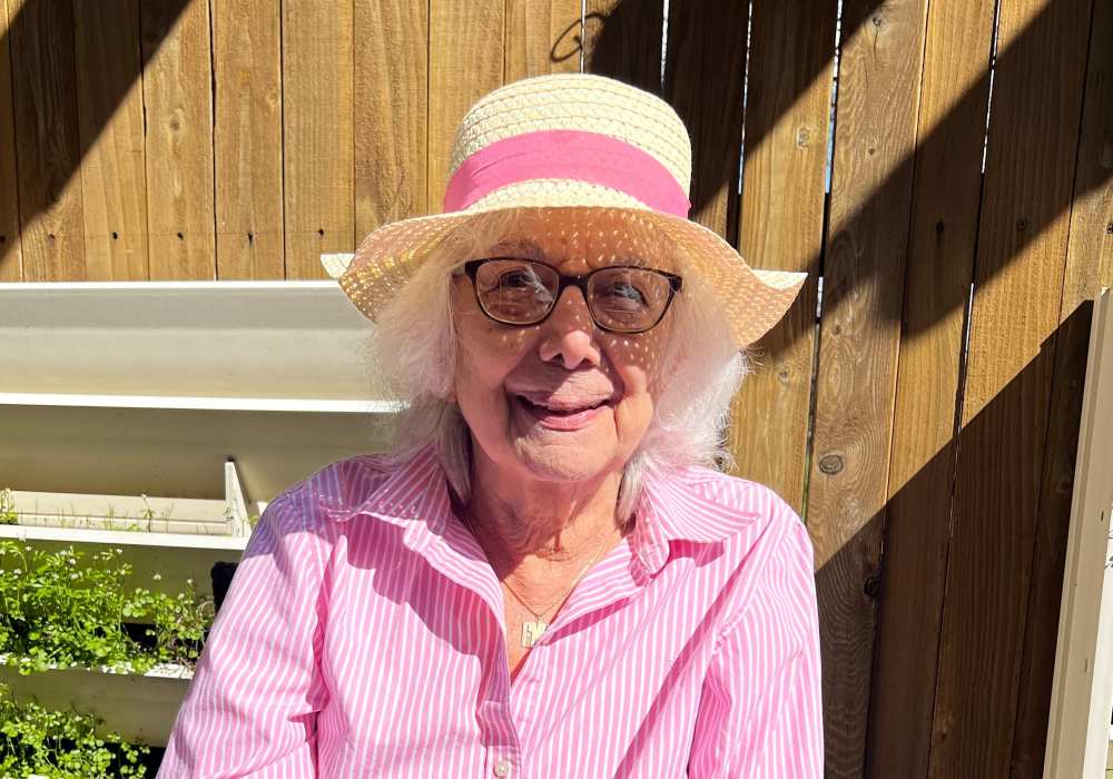 Resident wearing a sunhat at Merrill Gardens at Tacoma in Tacoma, Washington