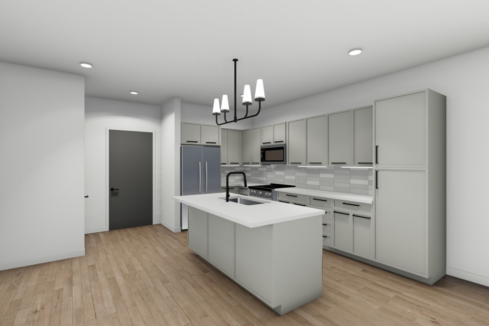 Ample natural light and quartz countertops in a model apartment's kitchen at Emma Jean Hull Flats in Benton Harbor, Michigan