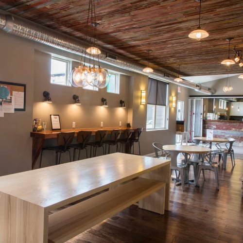 Tables and chairs in the study area at Prairie Pointe Student Living in Ankeny, Iowa