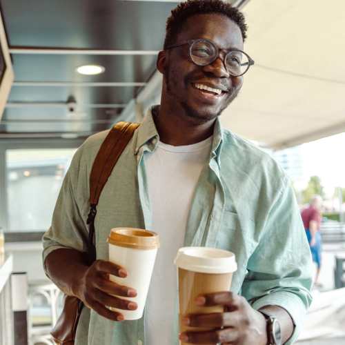 Resident holding coffee cup at Stonebrook in Oklahoma City, Oklahoma