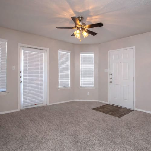 Living area with a ceiling fan at Villas de Toscana in San Antonio, Texas