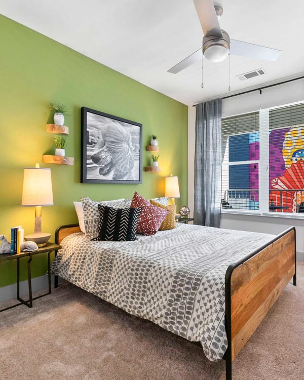 Model bedroom with ceiling fan and plush carpeting at EDGE on the Beltline in Atlanta, Georgia