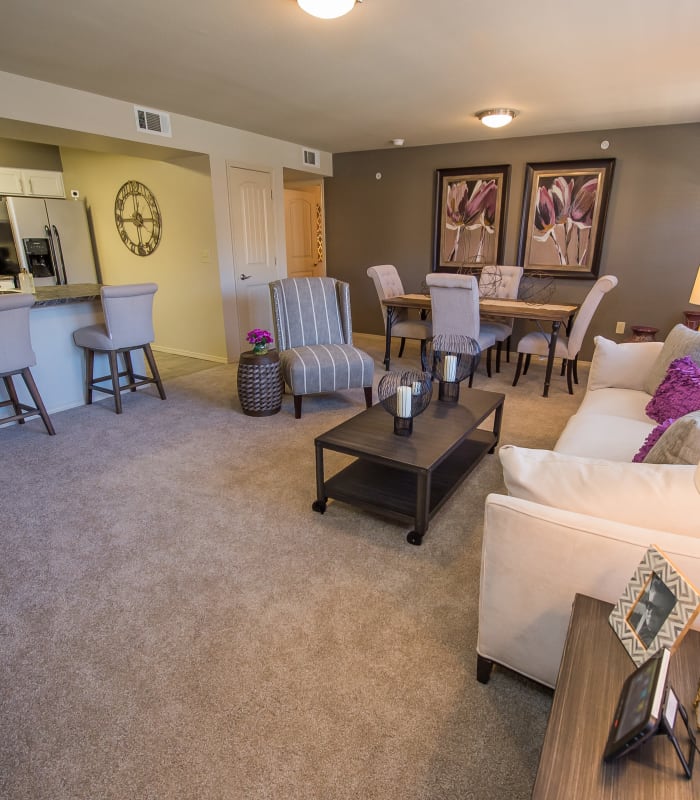 Carpeted living room at Mission Point Apartments in Moore, Oklahoma