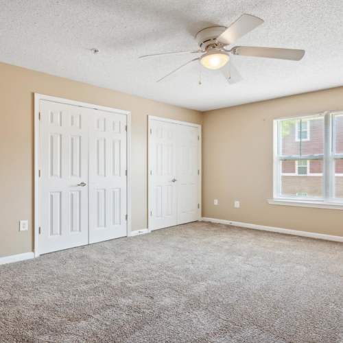 Bedroom with carpet flooring at Fellwood II in Savannah, Georgia