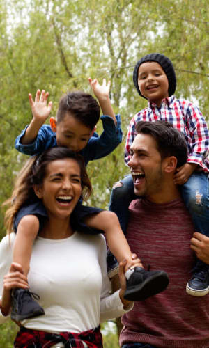 Family taking a walk through a park near Buffalo Run in Princeton, Texas