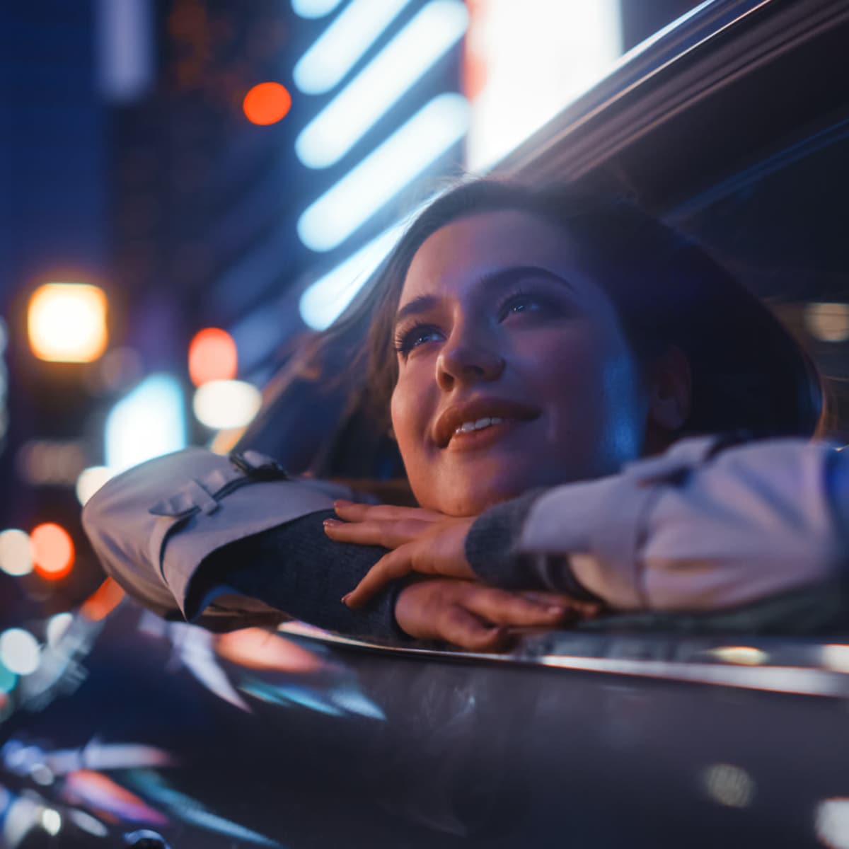 Resident leaning out of her car window while driving through the city near Emerald Place in Lancaster, Ohio   