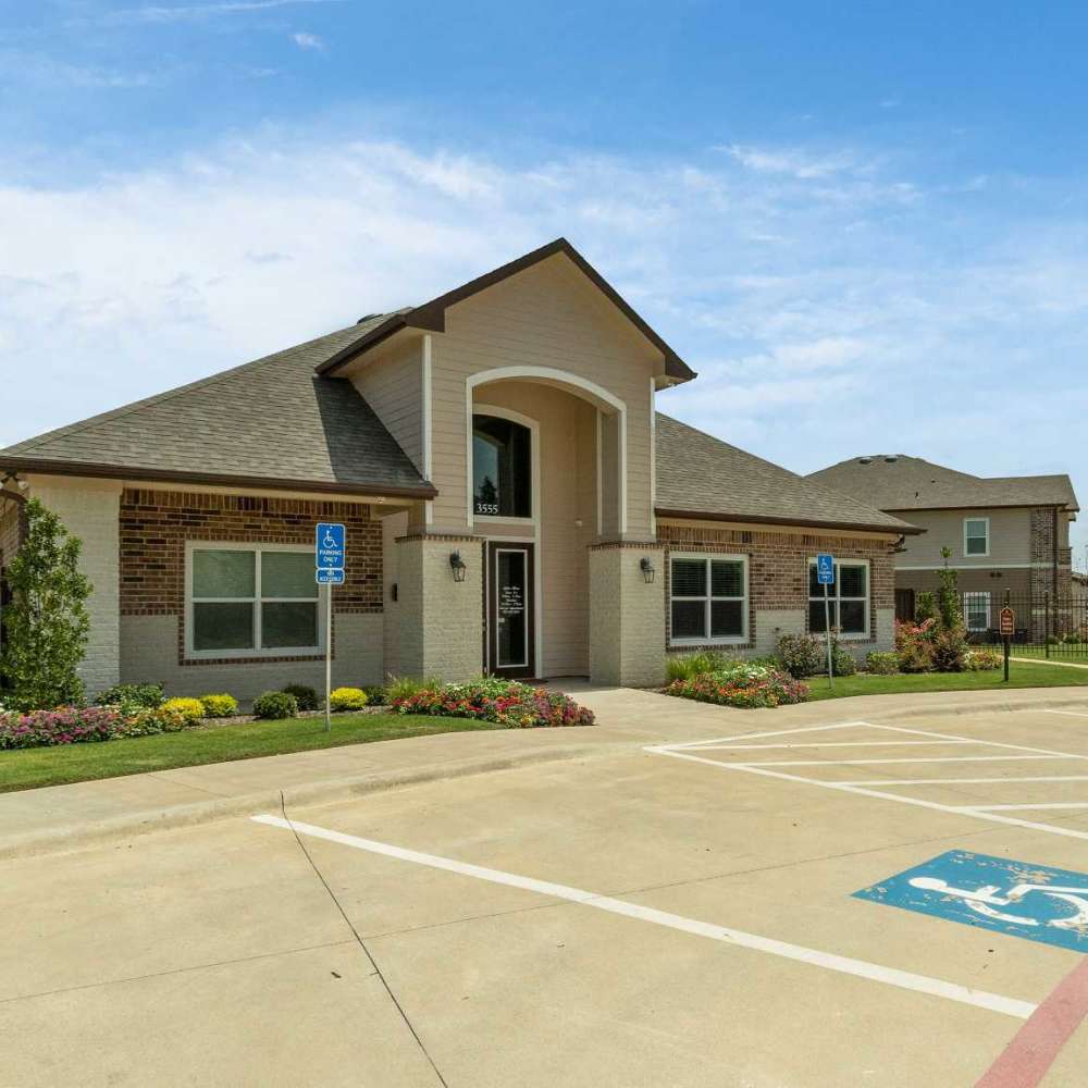 Exterior shot of leasing office at Pine Creek in Paris, Texas