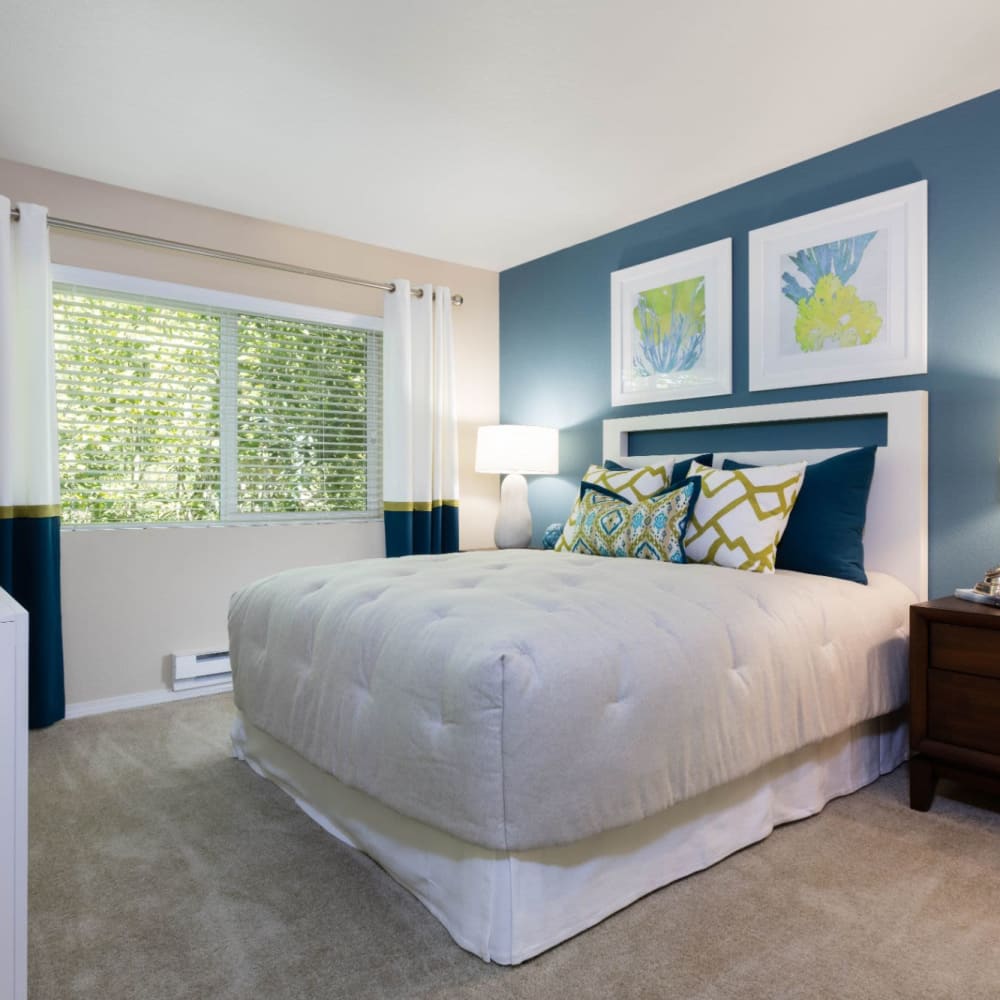 Spacious and modern open-concept floor plan with plush carpeting in a model home at Haven at Golf Creek in Portland, Oregon