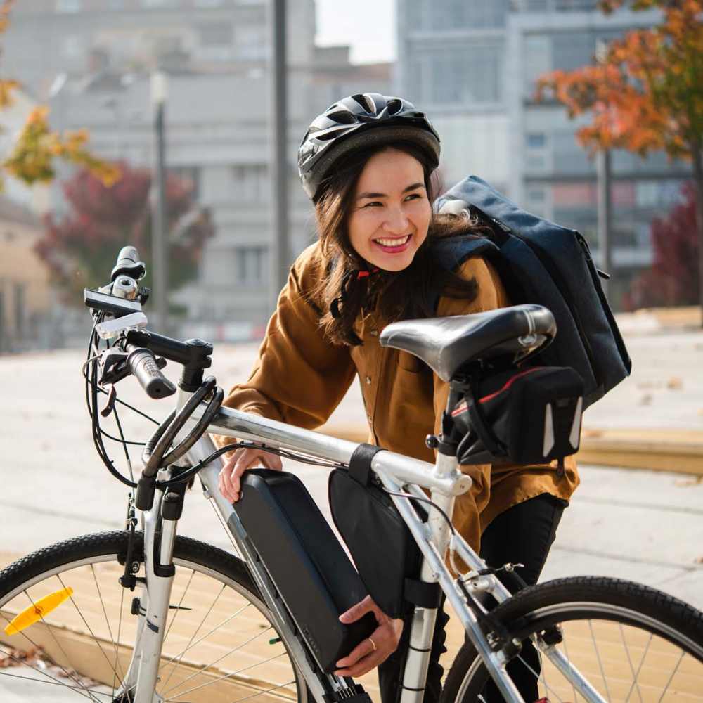 Resident with her bike near Clear Creek Crossing in Wheat Ridge, Colorado,