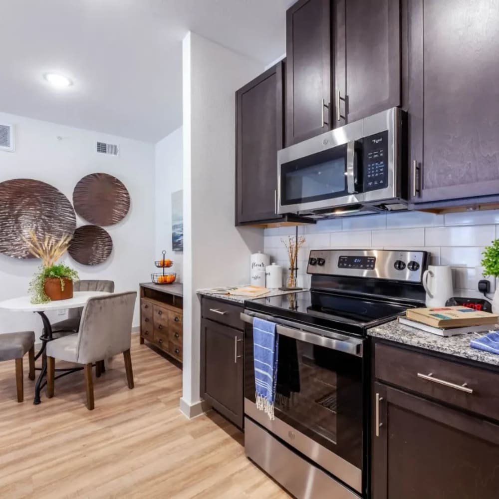 Kitchen with stainless-steel appliances at Luxia Grand Prairie, Grand Prairie, Texas