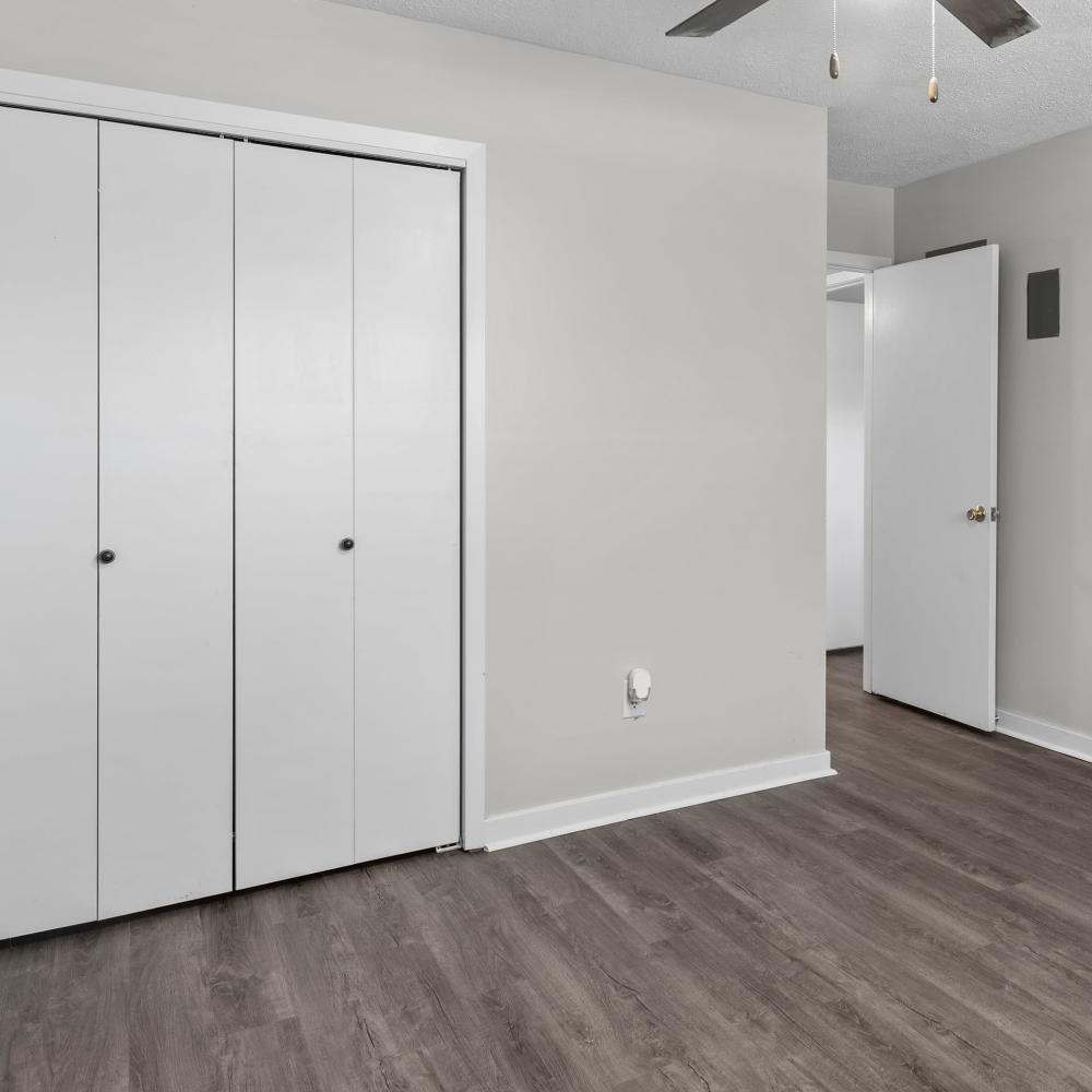 Charming bedroom with modern finishes and ample closet space at Pecan Ridge in Vicksburg, Mississippi.