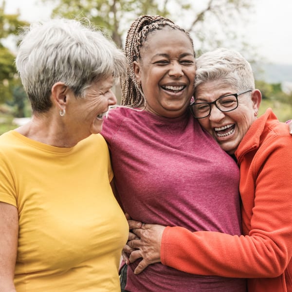 Group of residents embracing at Alta Vista Senior Living in Vista, California