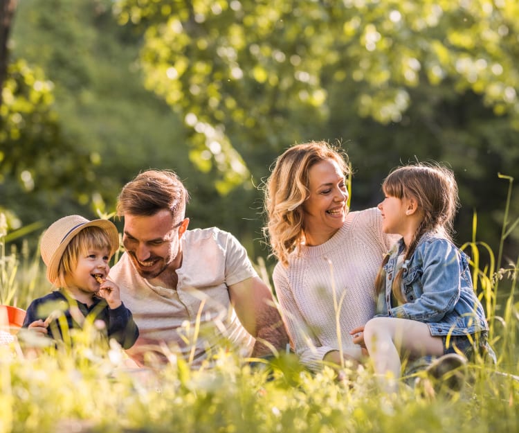 Family enjoying a picnic in lSanta Clara California near Cedartree Apartments