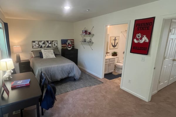 A bedroom with study and attached bathroom at Copper Beech Town Homes in Clovis, California