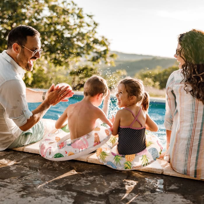 A family spending time at the pool at CovePointe at The Landings, Norfolk, Virginia