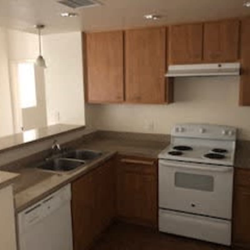 Kitchen with electric appliances at Oceana Apartments in Huntington Beach, California