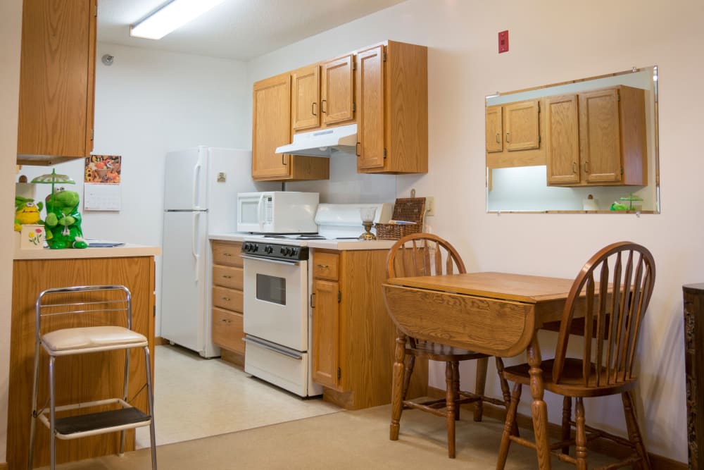 Galley kitchen in resident apartment at Meadow Lakes Senior Living in Rochester, Minnesota.