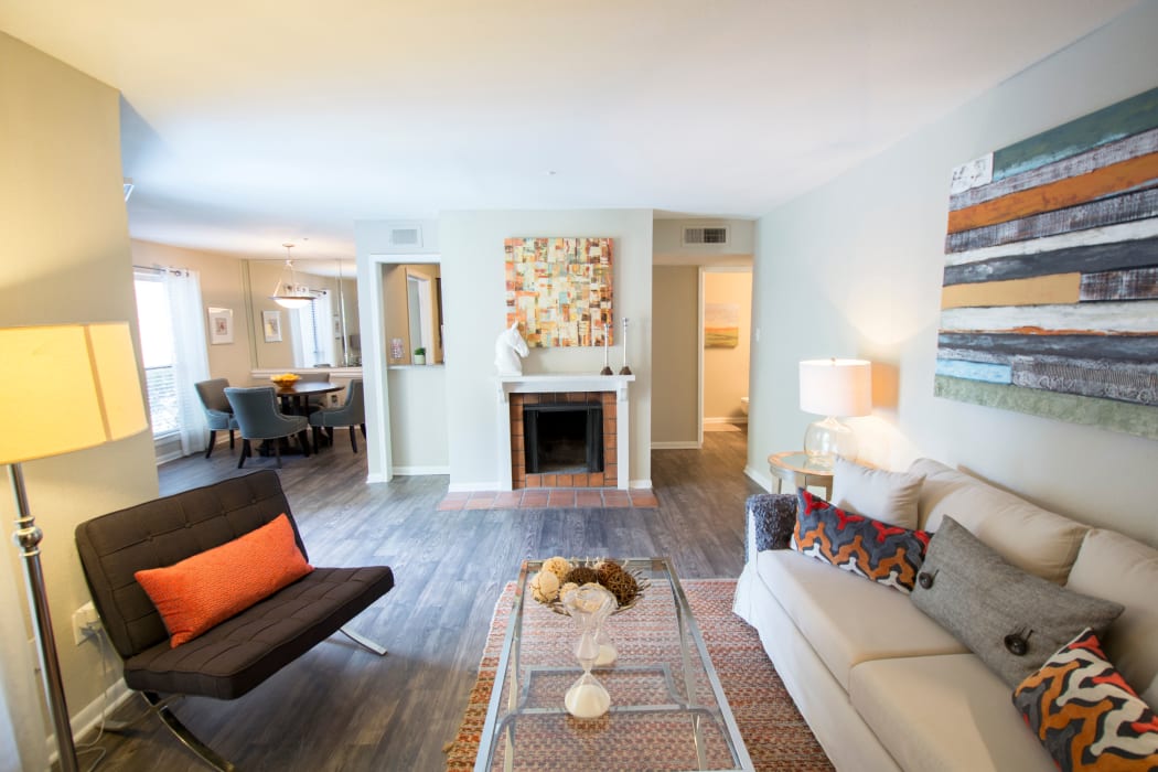 Wood-style flooring in a living room at Stonecrossing of Westchase in Houston, Texas.