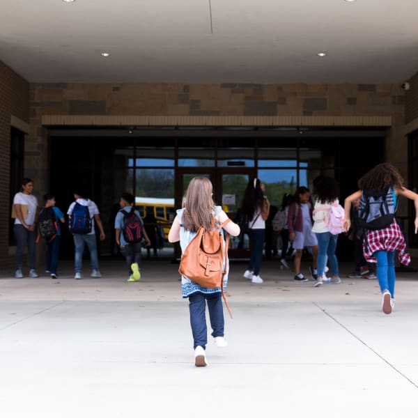 A kid walks into her school in Sunny Isles Beach, Florida