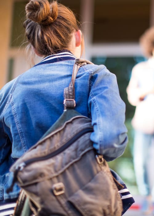 Resident walking to university in State College, Pennsylvania near RISE at State College