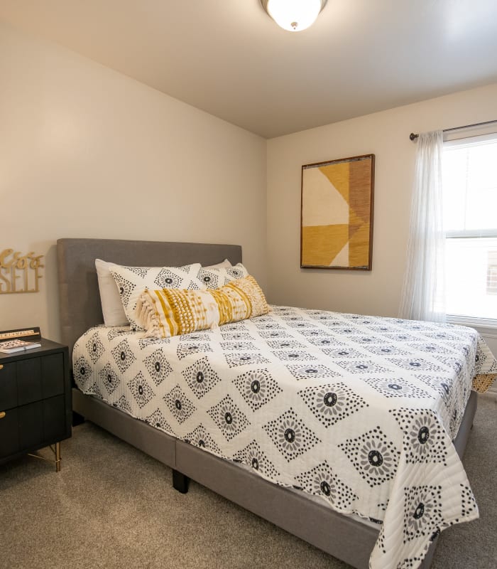 Chic bedroom with ceiling fan at Cross Timber in Oklahoma City, Oklahoma