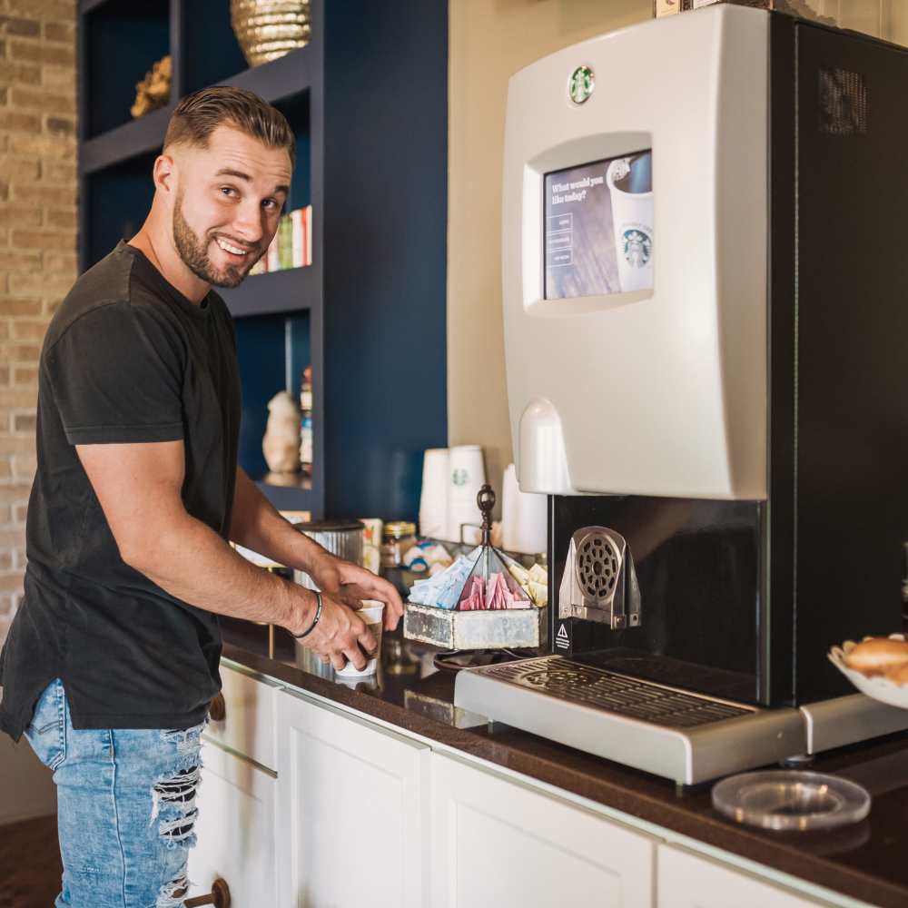 Resident making coffee in the kitchen at Springfield Apartments in Murfreesboro, Tennessee