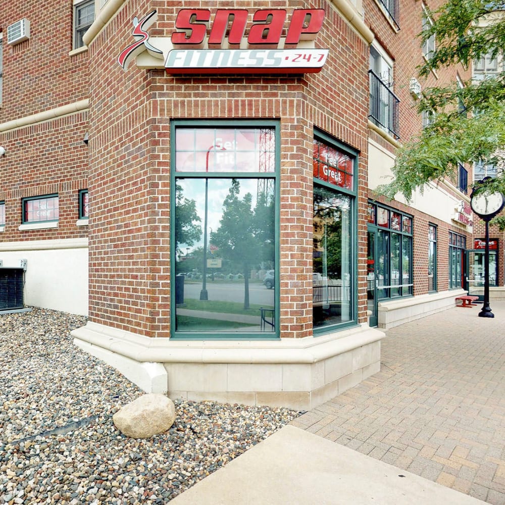 SNAP Fitness and other retail shops at ground level at Oaks Hiawatha Station in Minneapolis, Minnesota