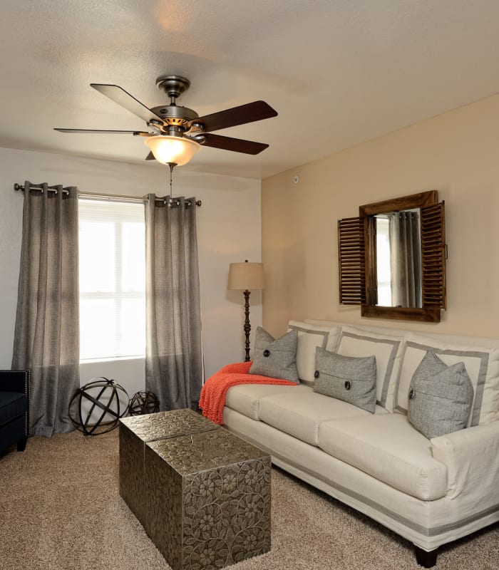 Carpeted living room at The Patriot Apartments in El Paso, Texas