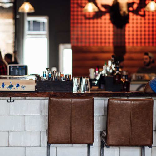 Leather chairs at the bar at Motif in Fort Lauderdale, Florida