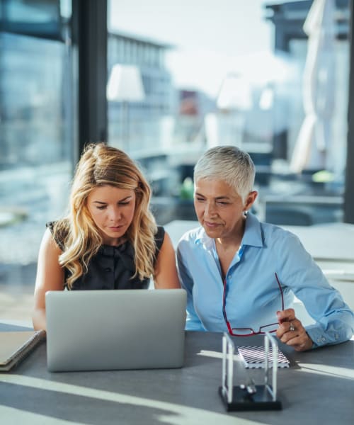 Coworkers collaborating in a modern office at Beztak Properties