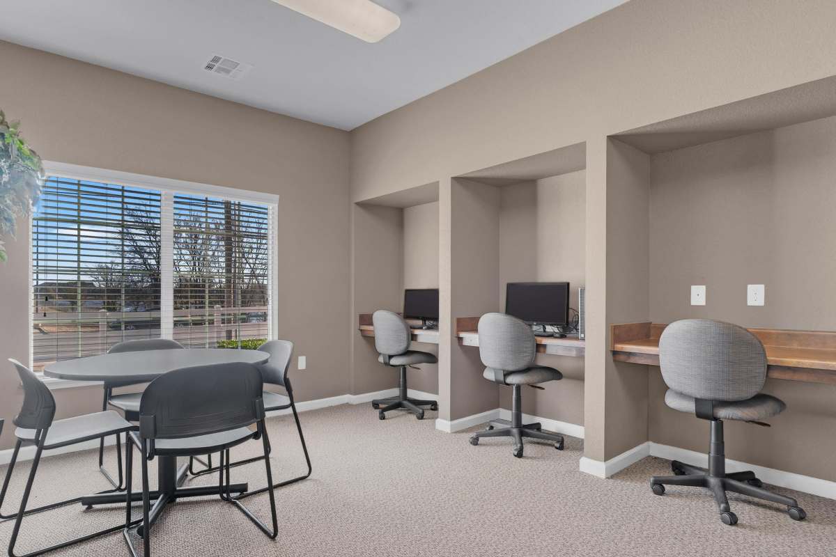 Bright, modern workspace with desk areas and natural light at Wickham Gardens in Sapulpa, Oklahoma 