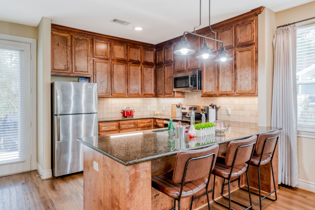 Stainless-steel appliances in a kitchen at Huntsville Village Apartments in Huntsville, Texas